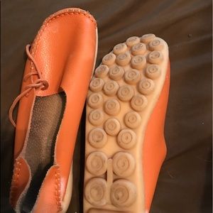 Orange flat slip ons